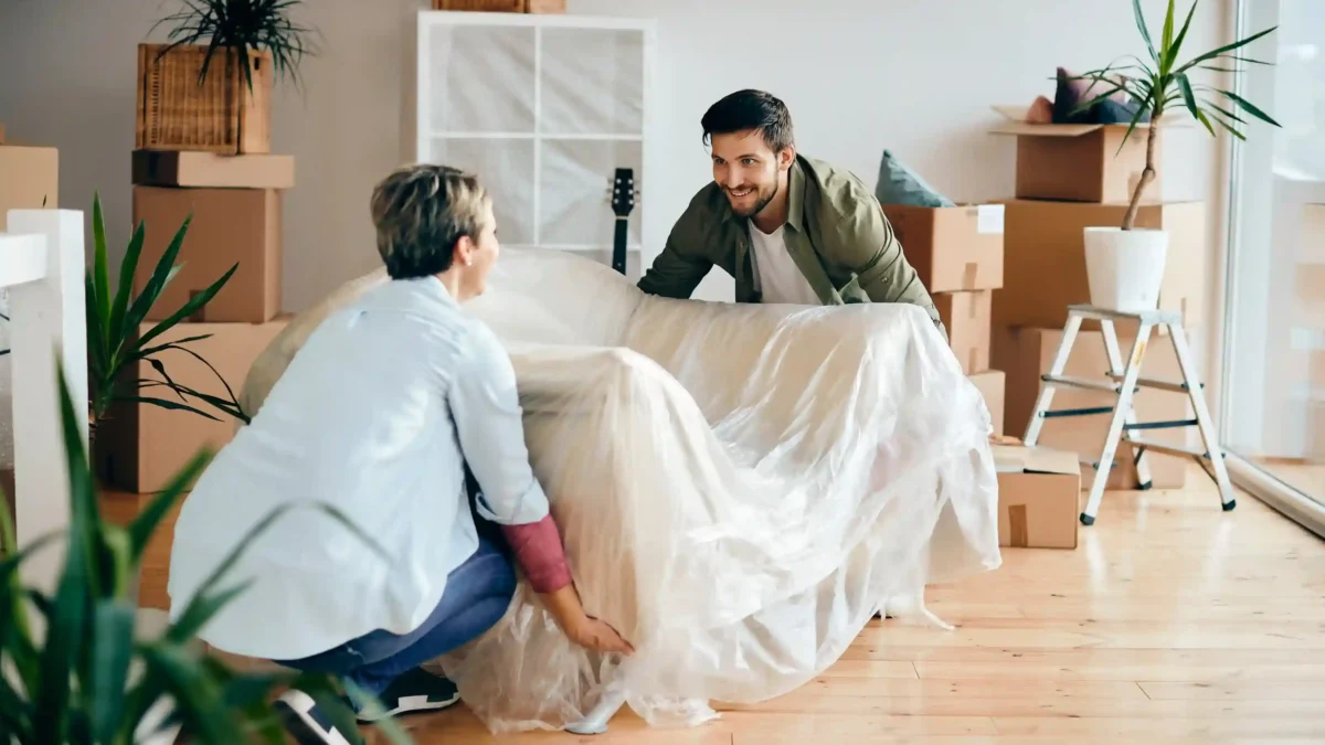 Furniture pickup service in Denver loading couch and chairs for removal