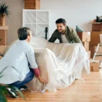 Furniture pickup service in Denver loading couch and chairs for removal
