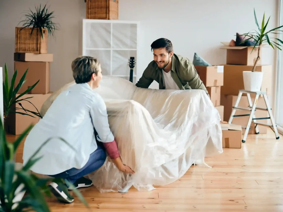 Furniture pickup service in Denver loading couch and chairs for removal